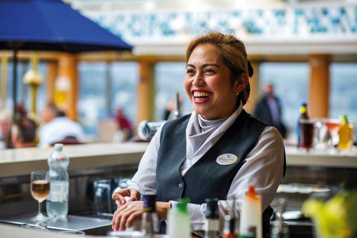 Fred. Olsen Cruise Lines Kiefer serving drinks at Bolette's Lido Bar.jpg